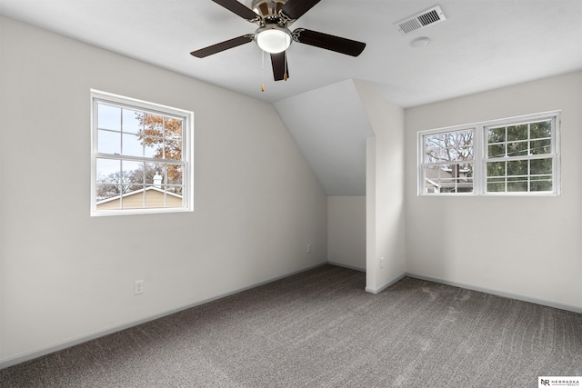 additional living space with carpet floors, vaulted ceiling, and ceiling fan