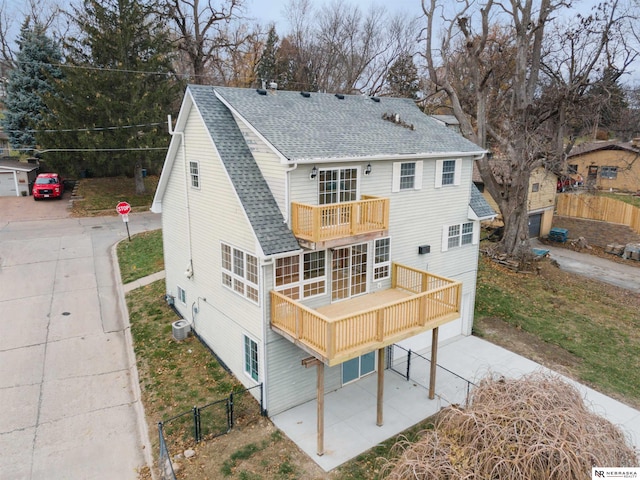 back of house with a balcony