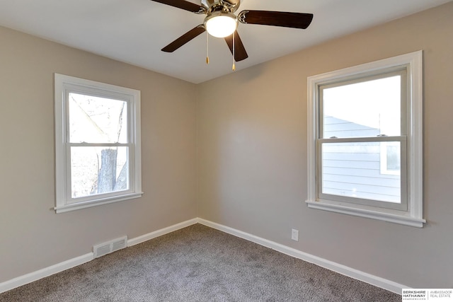 empty room with carpet floors and ceiling fan