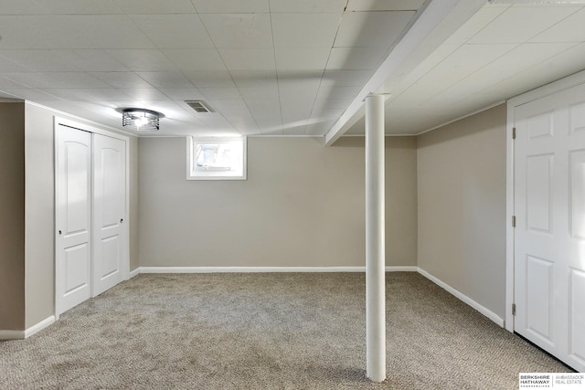 basement with light colored carpet