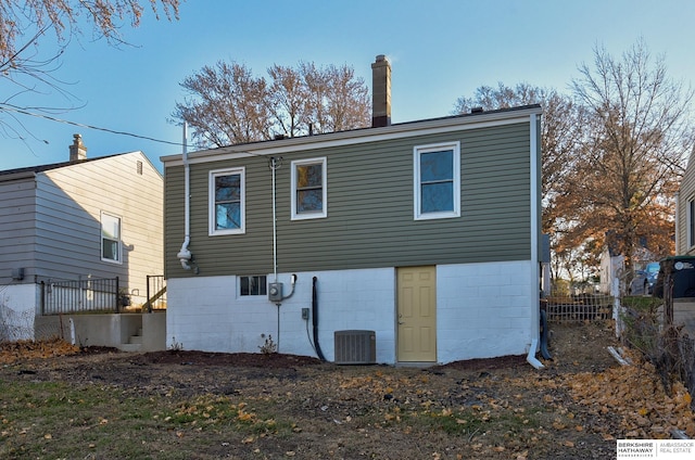 back of house featuring cooling unit