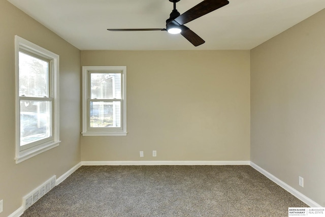 carpeted empty room with ceiling fan