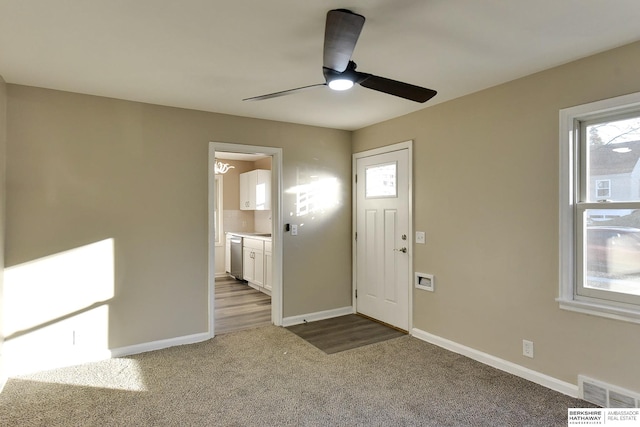 foyer featuring carpet floors and ceiling fan