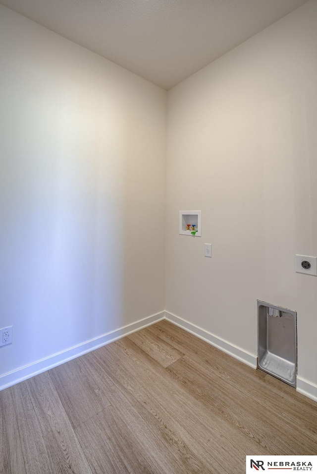 interior space featuring baseboards and wood finished floors