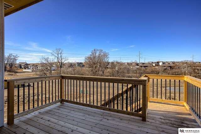 wooden deck with visible vents