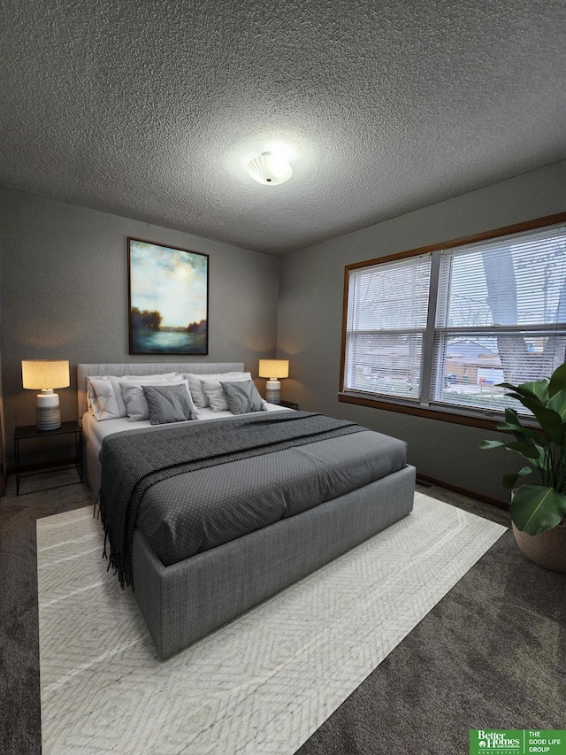 carpeted bedroom featuring a textured ceiling