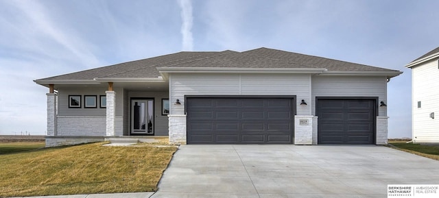 6614 S 200th Ave, Omaha, NE 68135 - view of front of property featuring concrete driveway, an attached garage, a front yard, and roof with shingles