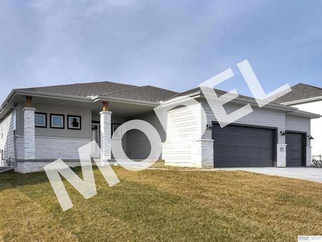 prairie-style home with a garage and a front lawn