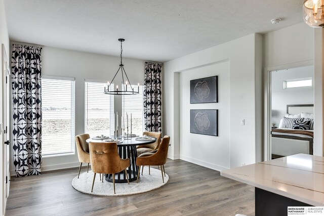 6614 S 200th Ave, Omaha, NE 68135 - kitchen featuring wall chimney exhaust hood, decorative backsplash, light wood-type flooring, stainless steel appliances, and light stone countertops
