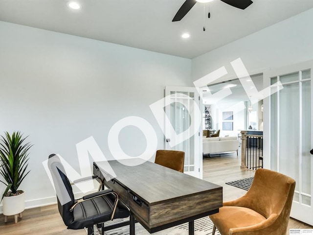 office area with light hardwood / wood-style flooring and ceiling fan