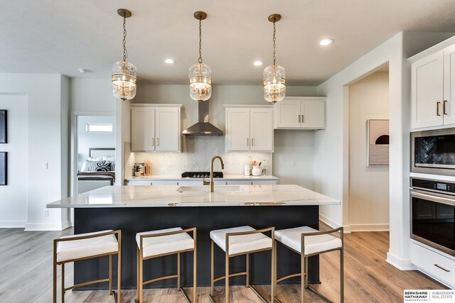 6614 S 200th Ave, Omaha, NE 68135 - foyer featuring a chandelier and wood finished floors
