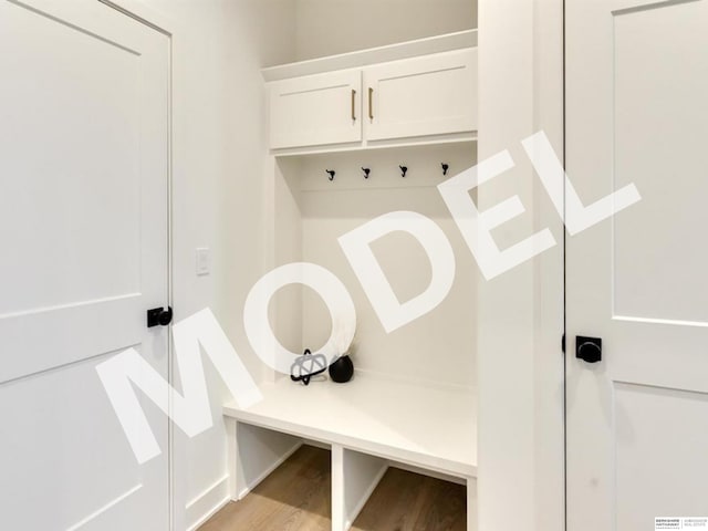 mudroom with light hardwood / wood-style floors