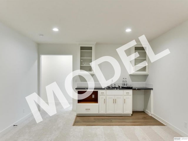 interior space featuring vanity and hardwood / wood-style flooring