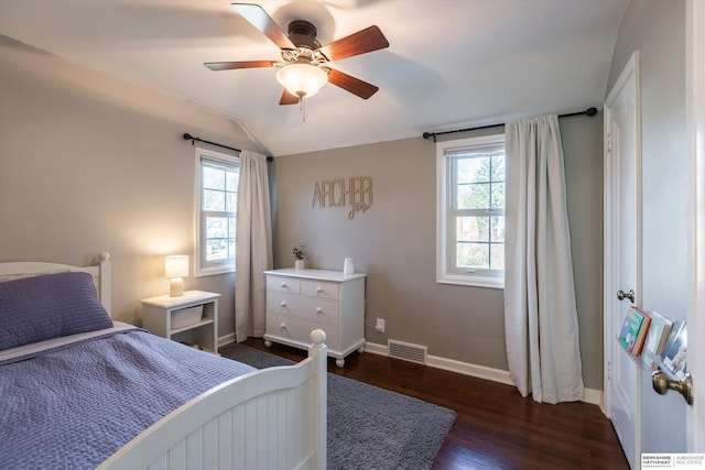 bedroom featuring lofted ceiling, ceiling fan, and dark hardwood / wood-style floors