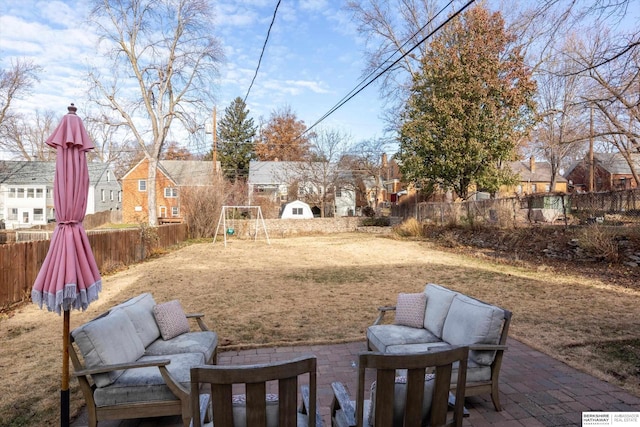 view of yard featuring a patio area and a playground