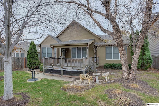 bungalow with a front yard