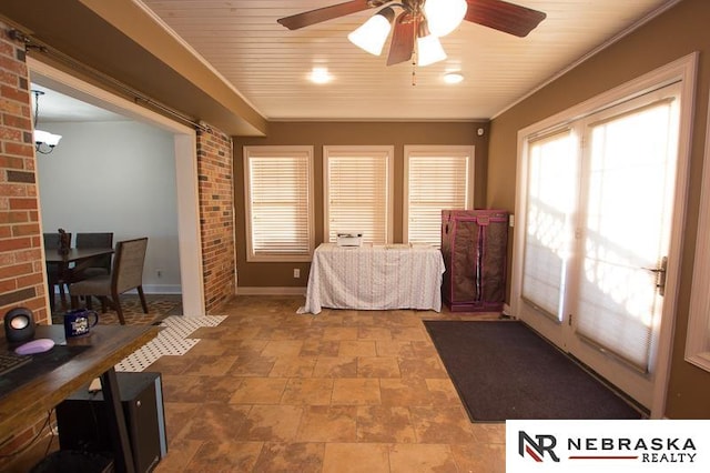 bedroom with ornamental molding and ceiling fan