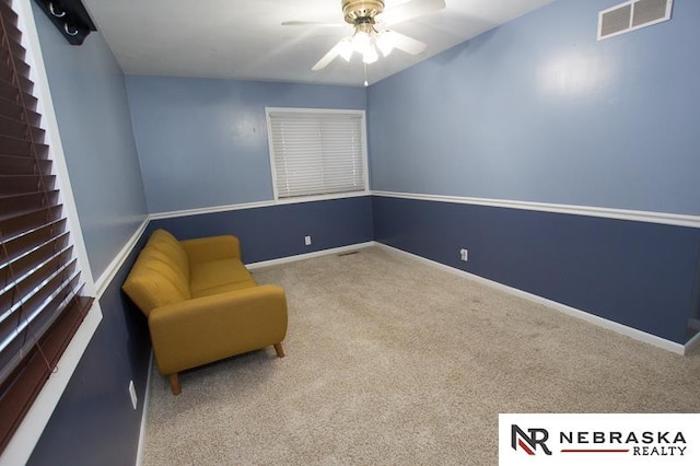 unfurnished room featuring carpet and ceiling fan