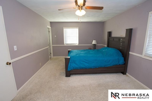 bedroom with light colored carpet and ceiling fan