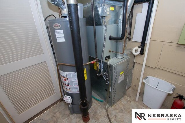 utilities featuring heating unit and gas water heater