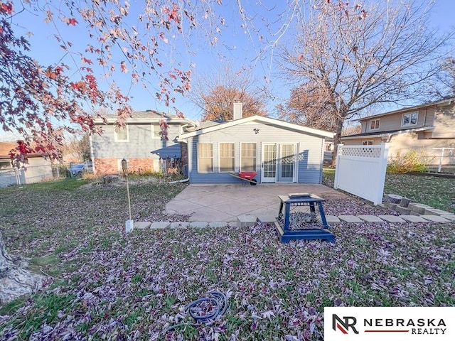 back of house with a patio area