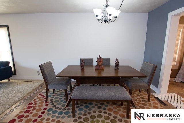 dining area with a chandelier