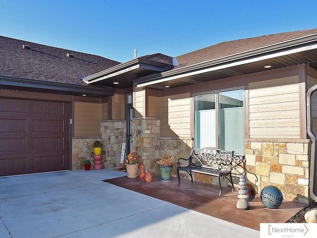 view of patio featuring a garage