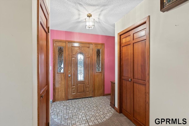 entrance foyer with a textured ceiling