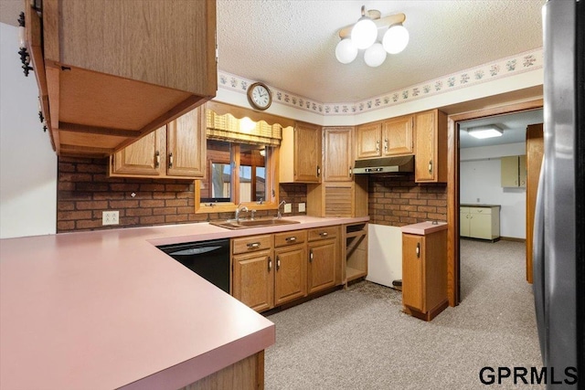 kitchen with dishwasher, light carpet, a textured ceiling, and sink