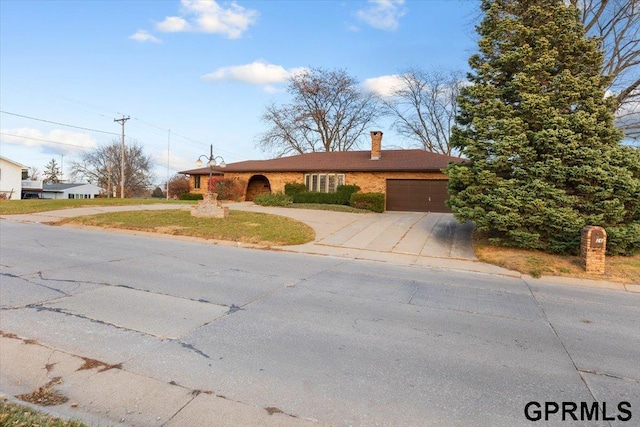 ranch-style home with a garage