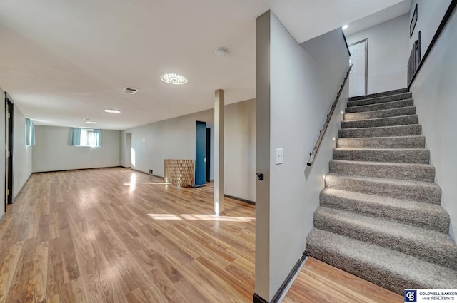 stairway with wood-type flooring