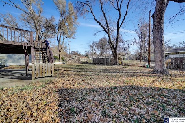 view of yard with a wooden deck