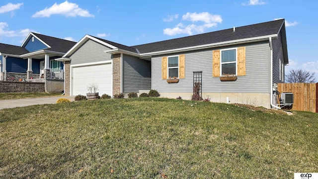 ranch-style home featuring central AC, a front yard, and a garage