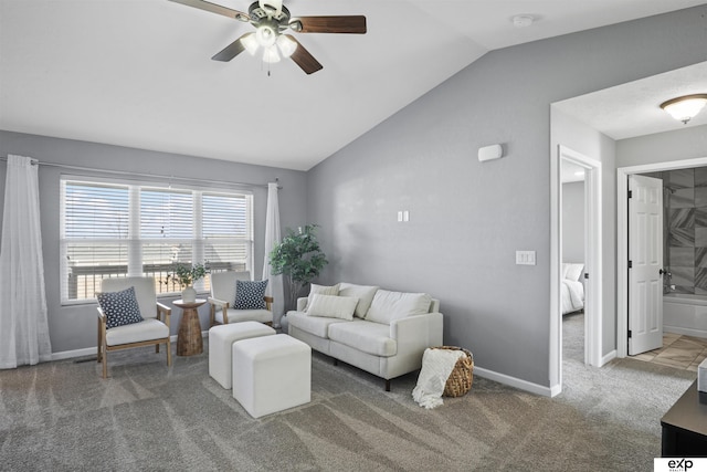 carpeted living room featuring ceiling fan and vaulted ceiling