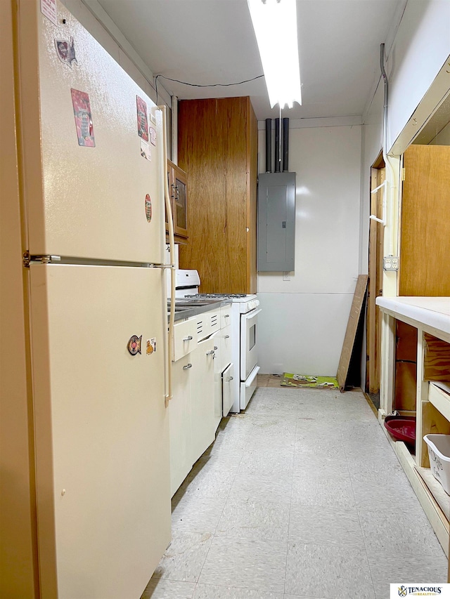 kitchen featuring white appliances and electric panel