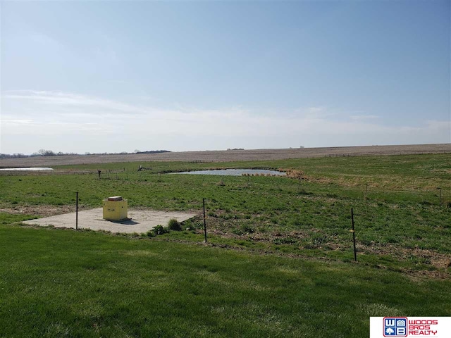 view of yard with a rural view