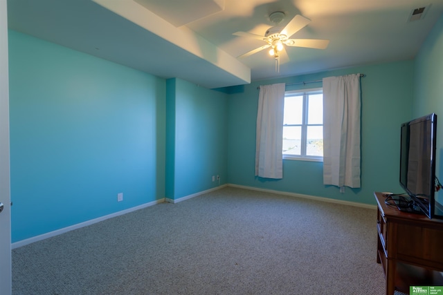 empty room with carpet and ceiling fan