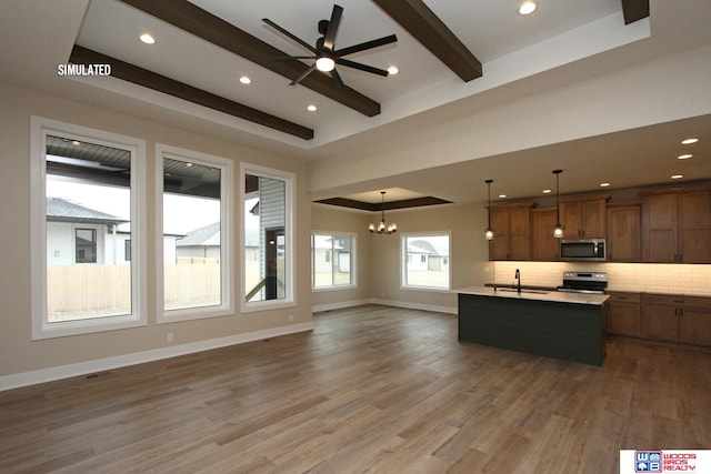 kitchen with an island with sink, tasteful backsplash, decorative light fixtures, wood-type flooring, and stainless steel appliances