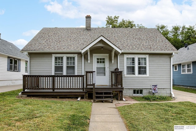 bungalow-style house with a front yard