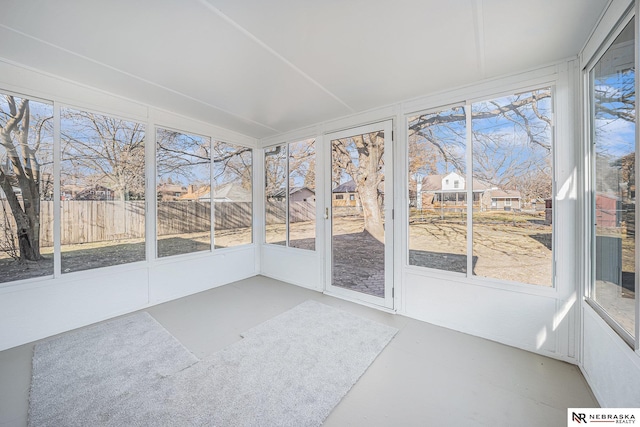 unfurnished sunroom featuring a wealth of natural light