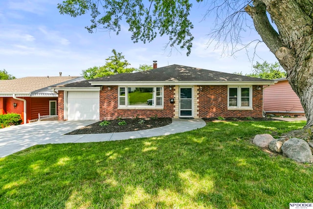 single story home featuring a front lawn and a garage