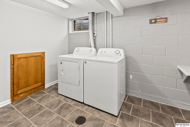 laundry room with washer and dryer and a textured ceiling