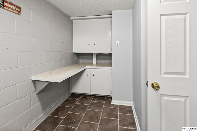 washroom with a textured ceiling