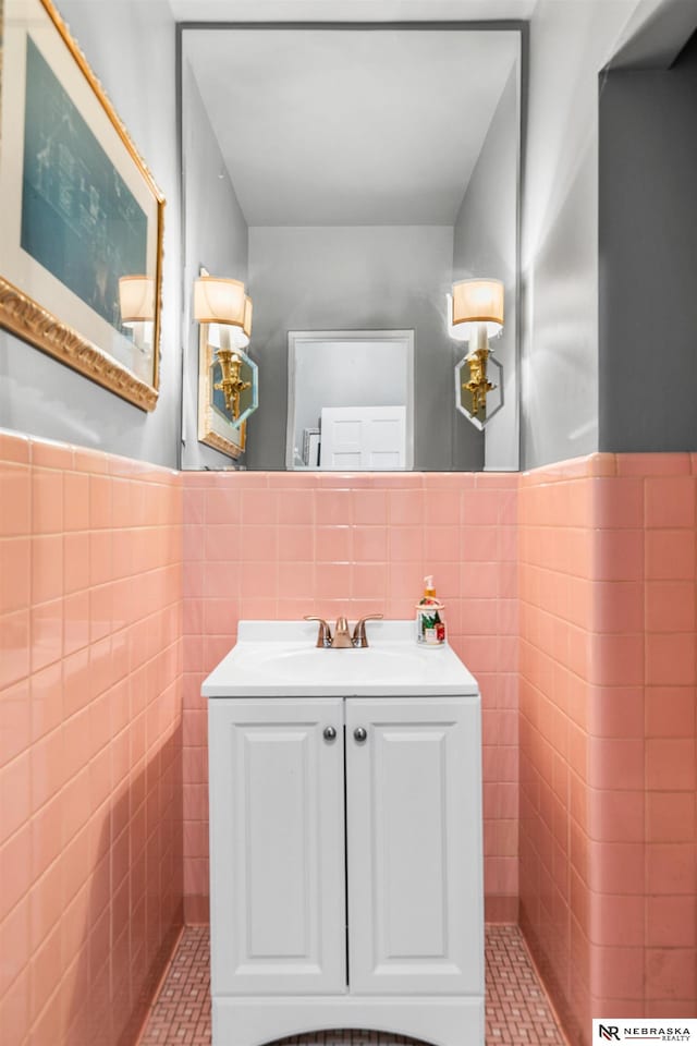 bathroom with vanity, tile patterned floors, and tile walls