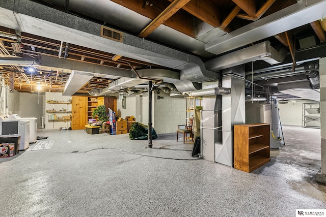 basement featuring separate washer and dryer and water heater