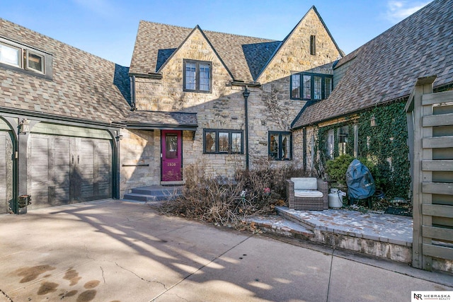 tudor home with a garage