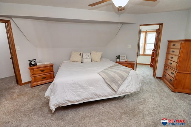 carpeted bedroom featuring ceiling fan and lofted ceiling