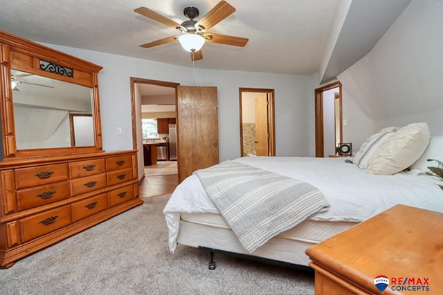 carpeted bedroom featuring ceiling fan and lofted ceiling