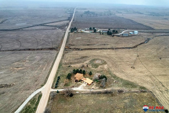 birds eye view of property featuring a rural view