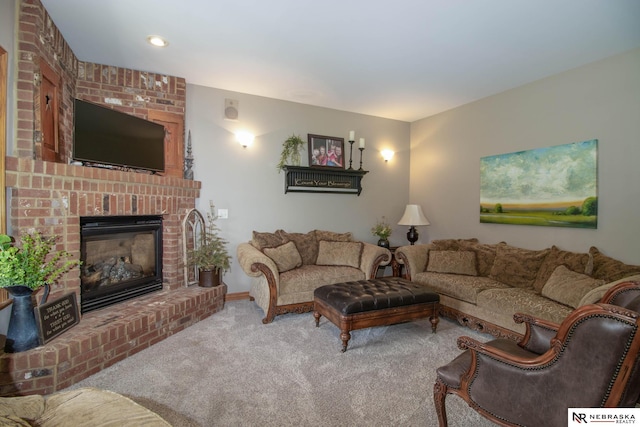 carpeted living room featuring a fireplace